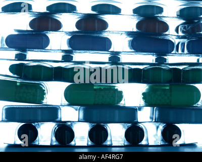 Backlit pills, tablets and capsules on white background, healthcare, medicine Stock Photo