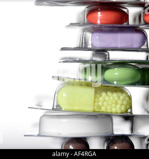Still life with pills tablets and capsules on white background - copy space on the left Stock Photo
