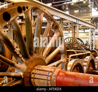 Heavy engineering workshop with railway wheels awaiting repair Stock Photo