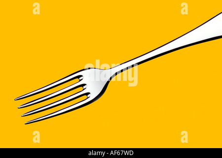 Fork Yellow Background Stock Photo
