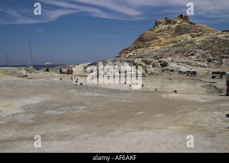 tourists bathing in mineral pool  Vulcano Stock Photo