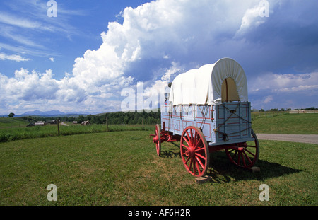 A conestoga wagon sits on the Great Plains on the U Bar Ranch a national historic site near Calgary, Canada. Stock Photo