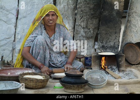 Bishnoi woman making chapattis in India Stock Photo