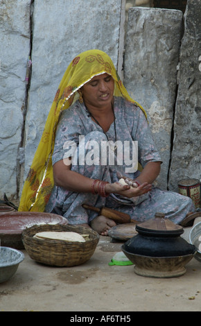 Bishnoi woman making chapattis in India Stock Photo