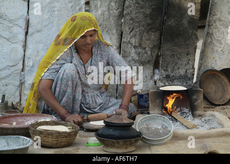 Bishnoi woman making chapattis in India Stock Photo