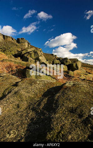 View of Burbage Rocks against a bright blue Spring sky Stock Photo