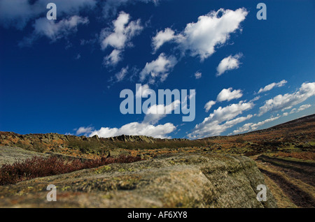 View of Burbage Rocks against a bright blue Spring sky Stock Photo