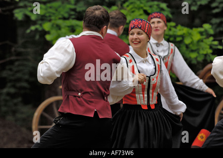 Traditional Latvian folk dancing, performed at the Lativan Open Air Ethnographic Museum (Latvijas etnografiskais brivdabas muzejs), near Riga, Latvia - MOTION BLUR Stock Photo