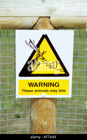 A warning sign that these animals may bite Stock Photo - Alamy