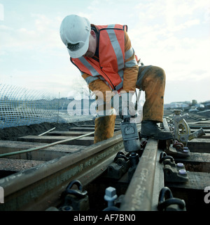 Railway engineer repairing track. Stock Photo