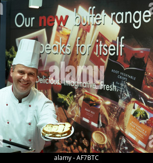 United Kingdom. England. Chef presenting plate of freshly made sandwiches. Stock Photo