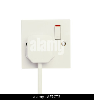 A white plug in an electric socket power on Stock Photo