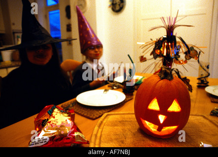 Halloween Party Children Dressed Up Pumpkin On Table Stock Photo