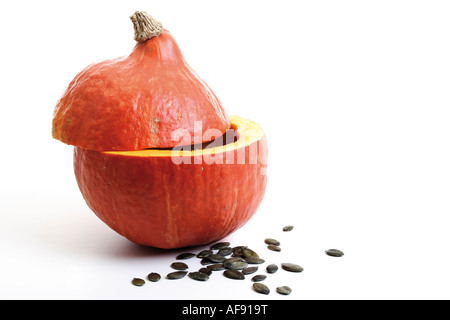 Halved pumpkin with pumpkin seeds Stock Photo