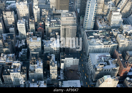 view north and down towards building rooftops and fifth 5th avenue ave from observation deck 86th floor Stock Photo