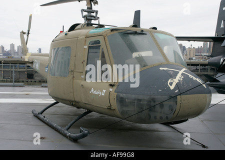 Bell UH 1A Huey on display on the flight deck at the Intrepid Sea Air Space Museum new york city new york USA Stock Photo