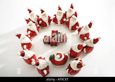 Santa Claus figurines standing in circle Stock Photo