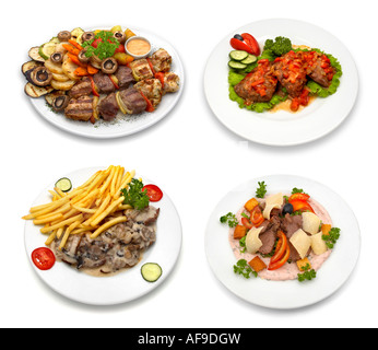 4 dishes with chicken, veal, pork meat and vegetables Stock Photo