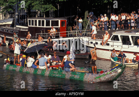 Netherlands Amsterdam People in boat made of empty plastic bottles Stock Photo