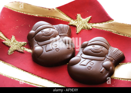 Chocolate snowmen on Christmas plate Stock Photo
