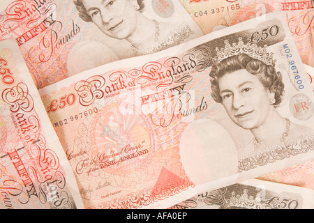 Fifty pounds sterling notes spread out to form a background Stock Photo