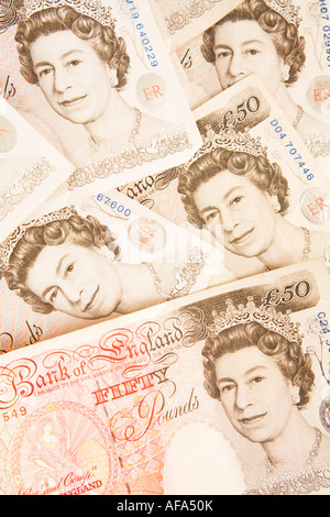 Fifty pounds sterling notes spread out to form a background Stock Photo