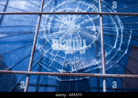 broken window with rusty security steel bars Stock Photo