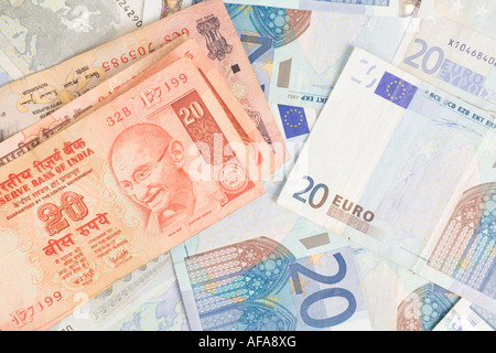 Indian rupee notes on top of euro bills Stock Photo