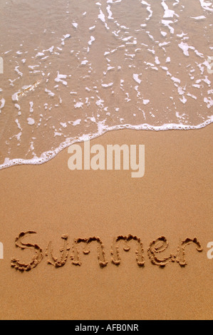 Summer written in sand at the beach Stock Photo