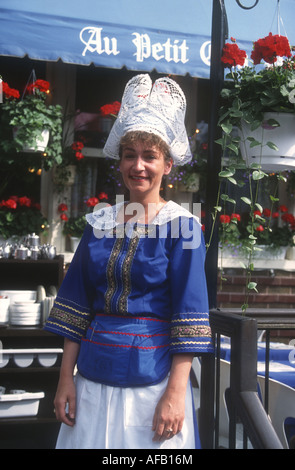 At the Au Petit Coin restaurant in Quebec ,a french Canadian waitress wearing the traditional French Bretonne Lace bonnet Stock Photo