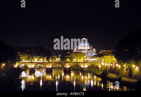 A distant view across the Tiber River of the dome of Saint Peter s Basilica in the Vatican Rome Stock Photo