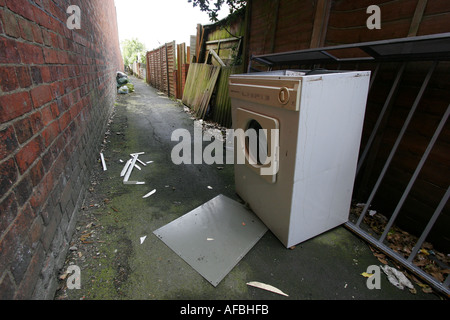 Abandoned Kitchen Appliances In Alleyway To Rear Of Terraced Houses Stock Photo Alamy