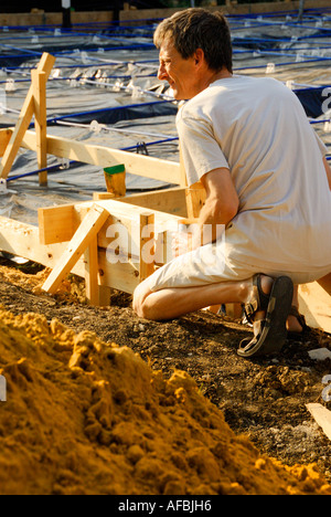 man kneeling Stock Photo