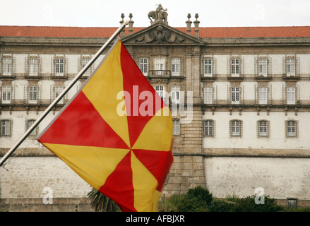 Yellow and red flag flying in front of the Convent of Santa Clara, Vila do Conte, Northern Portugal Stock Photo