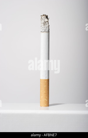 cigarette standing Burning cigarette upright standing Stock Photo