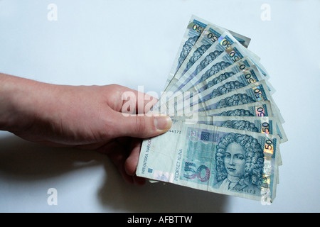 Hand held fan of Kuna cash Stock Photo