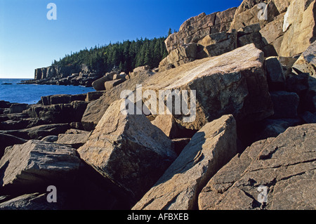 Worn by waves and weather giant granite boulders tumble near Otter Point Acadia Nationial Park Maine Stock Photo