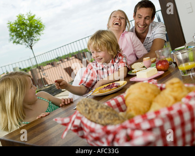 Family at breakfast table Stock Photo