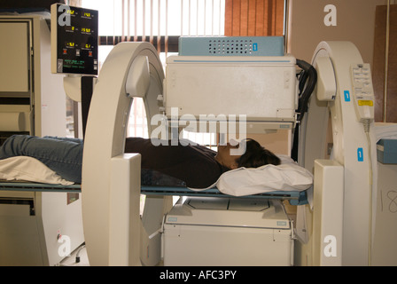 Woman undergoing Radionucleide Cisternography using Gamma Camera Stock Photo