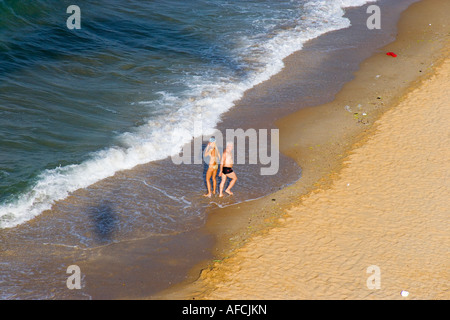 Couple walking in the sea at the shore aerial Gumusdere Black Sea coast of Istanbul Turkey Stock Photo