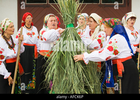 Countrywomen dressed in traditional Ukrainian costumes, performing a rural folk dance in Mirnopolje, Ukraine Stock Photo