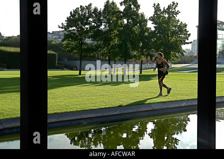 Woman Jogging In Public Park Photograph by Microgen Images/science Photo  Library - Pixels