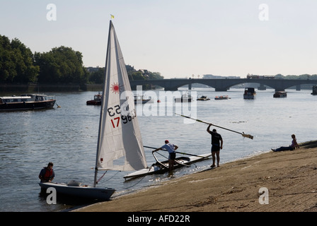 River Thames at Putney sailing boats and rowing boat. Putney bridge London south west London SW15 UK 2007 Engkand HOMER SHYKES Stock Photo