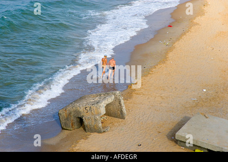 Couple walking in the sea at the shore aerial Gumusdere Black Sea coast of Istanbul Turkey Stock Photo