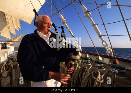 Royal Clipper Captain, Klaus Mueller Playing Bagpipes, Sailing in Mediterranean Sea, Italy Stock Photo