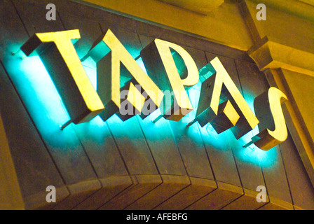 Illuminated Tapas sign on restaurant in Nerja Spain Stock Photo