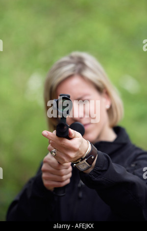 The zoo veterinary surgeon of the zoo Allwetterzoo Dr Sandra Silinski during her work with a stun gun Stock Photo