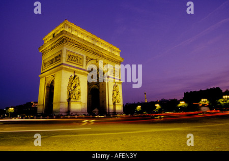 A view at sunset of the Arc de Triomphe at the end of the Avenue des Champs Élysées, Paris, France. Stock Photo