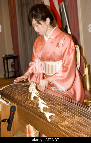 Japanese woman plays the koto Stock Photo