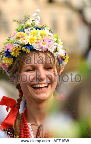 Poland, Cracow. Polish girls in traditional dress dancing in Market ...